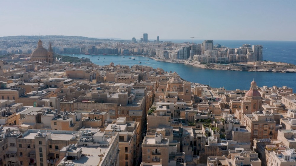 Aerial view over the rooftops of Valletta towards Marsamxett Harbour and Sliema, Malta.